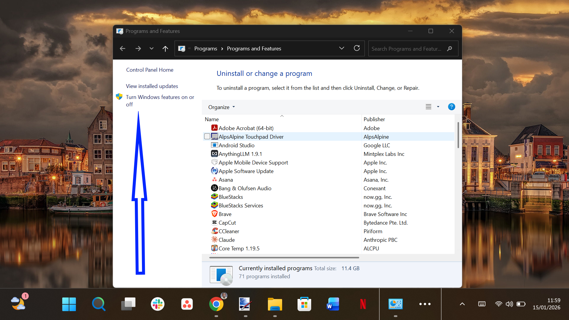 Control Panel Programs list showing installed Android emulation software like BlueStacks.