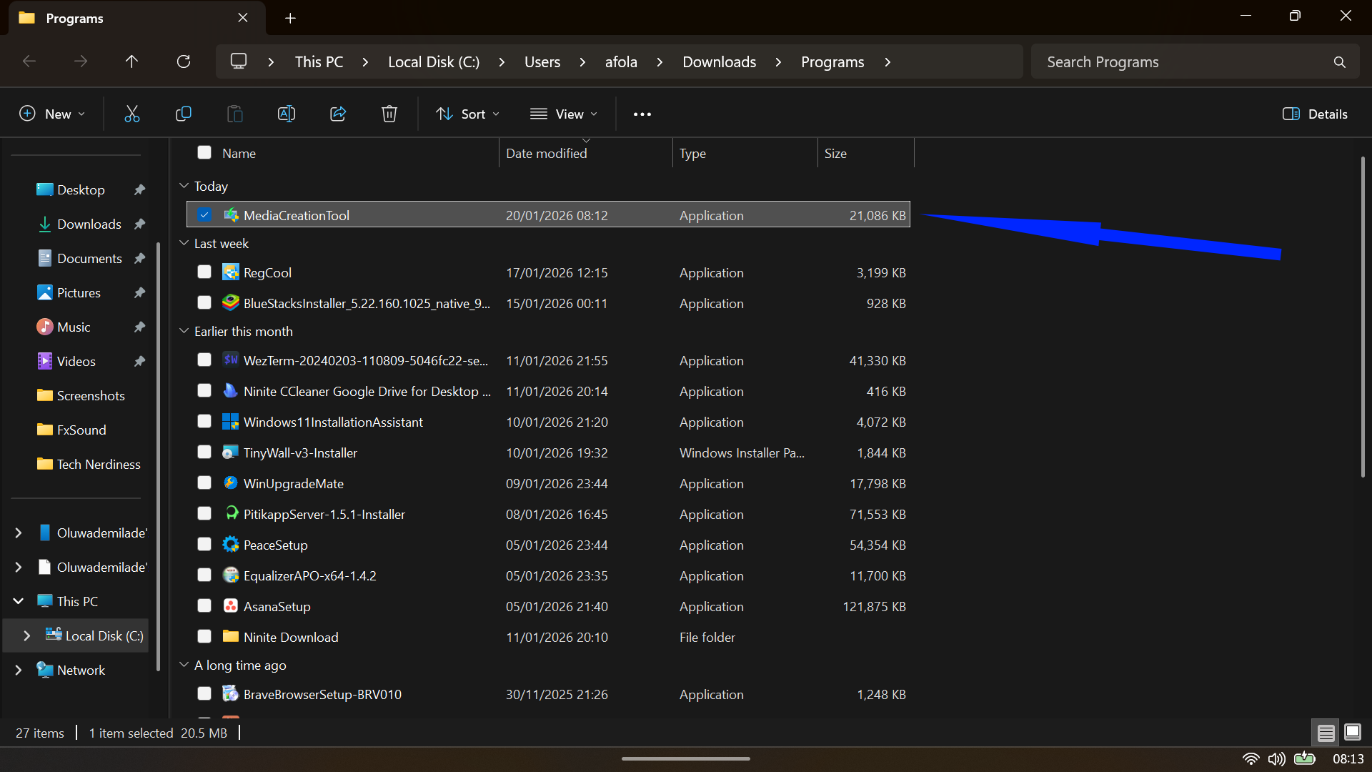 File Explorer window displaying the newly downloaded MediaCreationTool application file in the Programs folder.