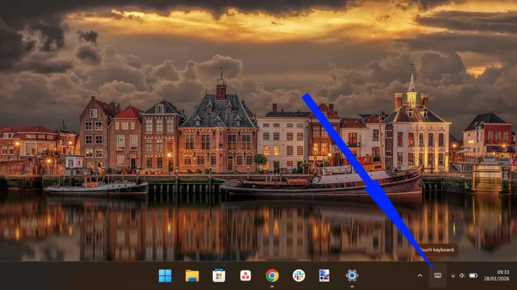 Windows taskbar system tray displaying the newly enabled Touch Keyboard icon.