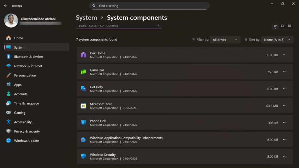 Windows System settings menu with arrows highlighting the System components and AI components sections.