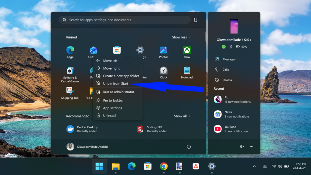 Windows 11 Start menu showing a blue arrow pointing to the Unpin from Start option in an app's context menu.