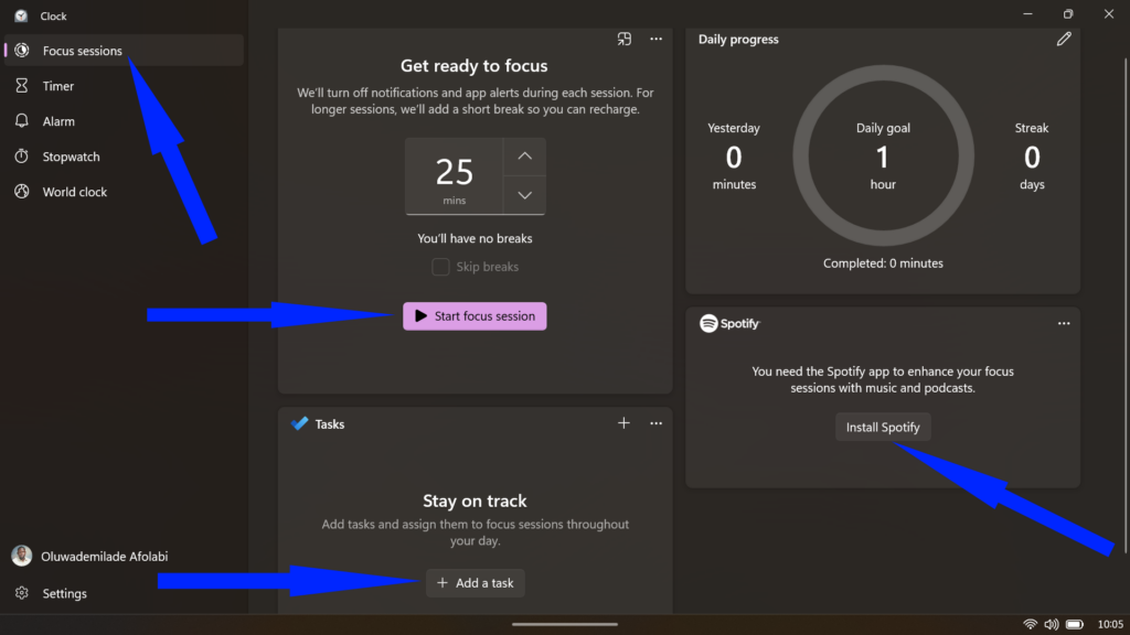Windows Clock Focus sessions dashboard featuring a 25-minute timer, daily progress tracker, task list, and Spotify integration options.