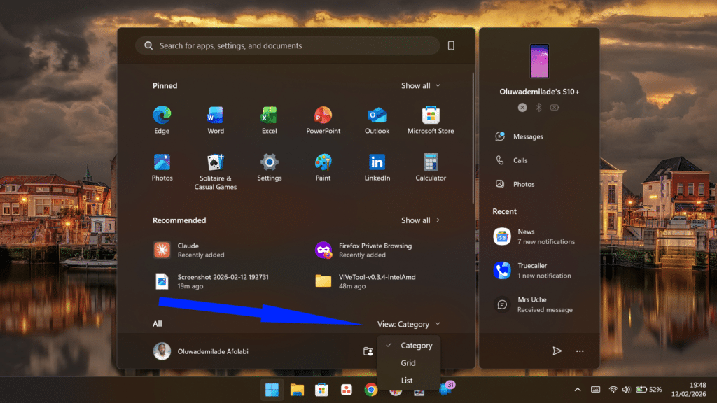 Windows Start menu with a blue arrow pointing to the View Category dropdown menu.