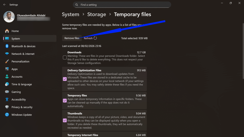 Windows Storage settings showing temporary files categories and a Remove files button to reclaim disk space.